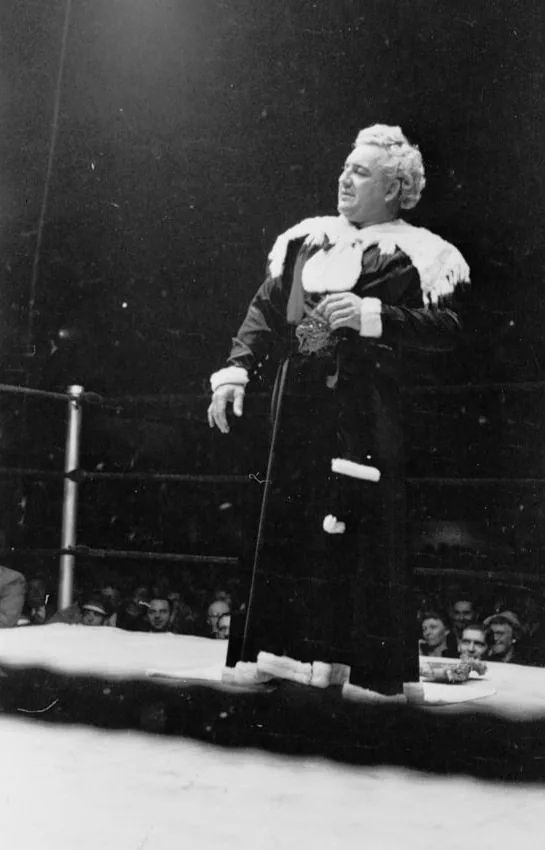Gorgeous George standing in a wrestling ring in a long robe in 1949, Library of Congress photograph