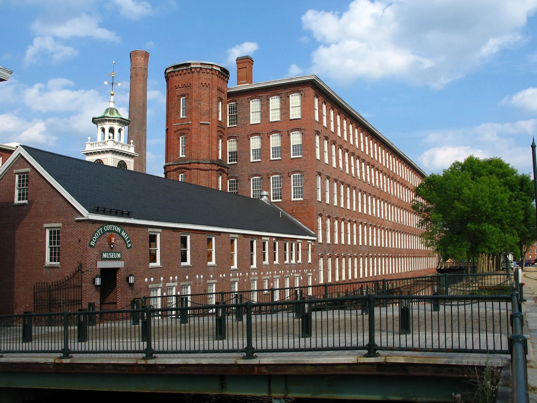 The real red-brick Boott Cotton Mills and canal in Lowell, now preserved as a museum.