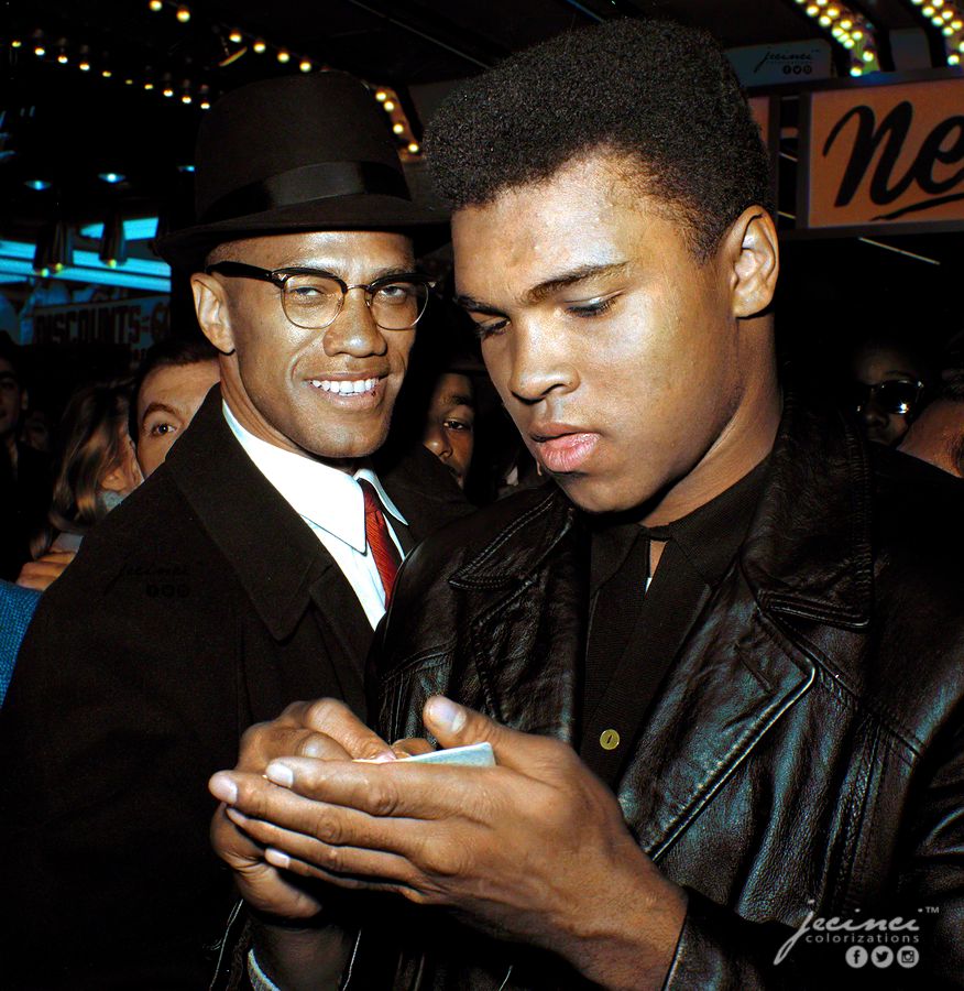 Malcolm X and Muhammad Ali standing together in a crowd.