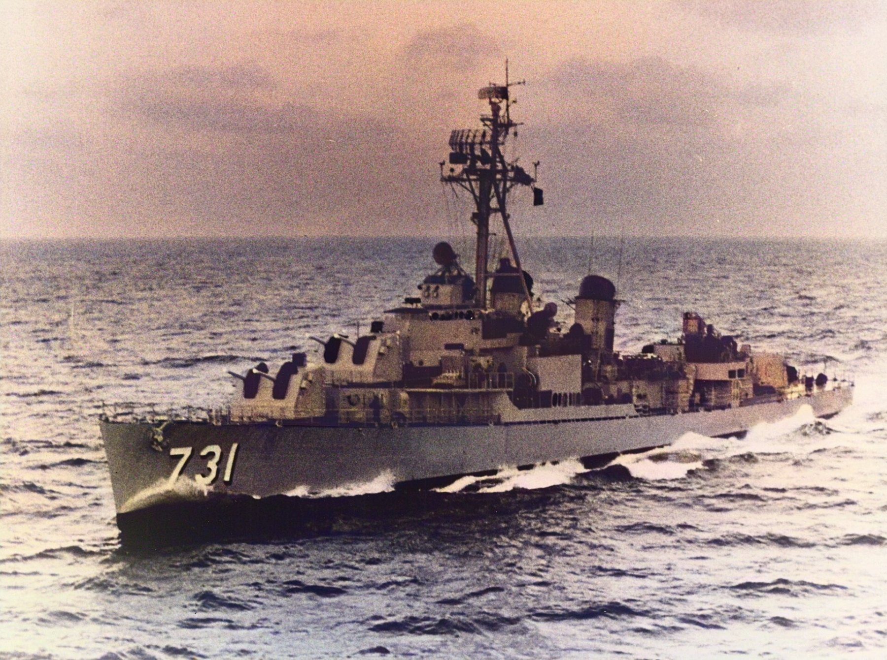 The destroyer USS Maddox, hull number 731, cutting through open sea.
