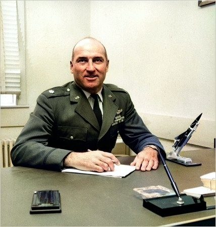 Portrait of Kermit Tyler as a later Air Force officer seated at a desk.