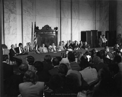 A wide view of a crowded Senate hearing room with the committee at a long table.