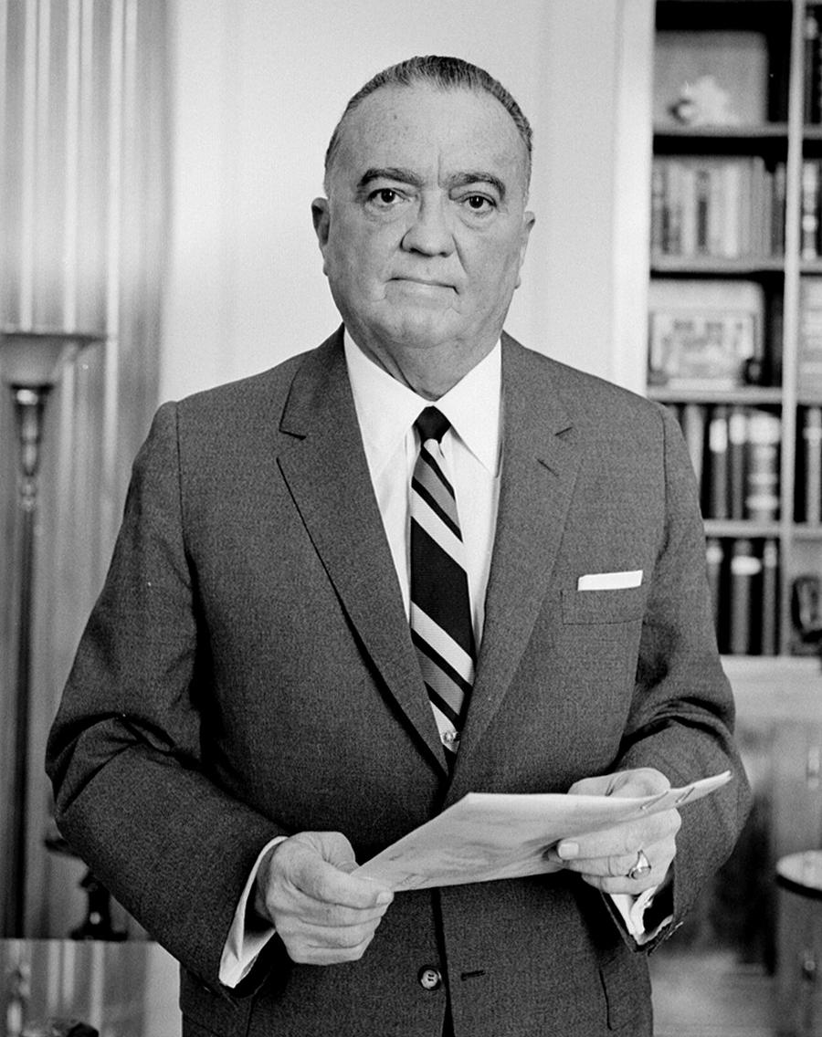 Portrait of J. Edgar Hoover seated in a suit.