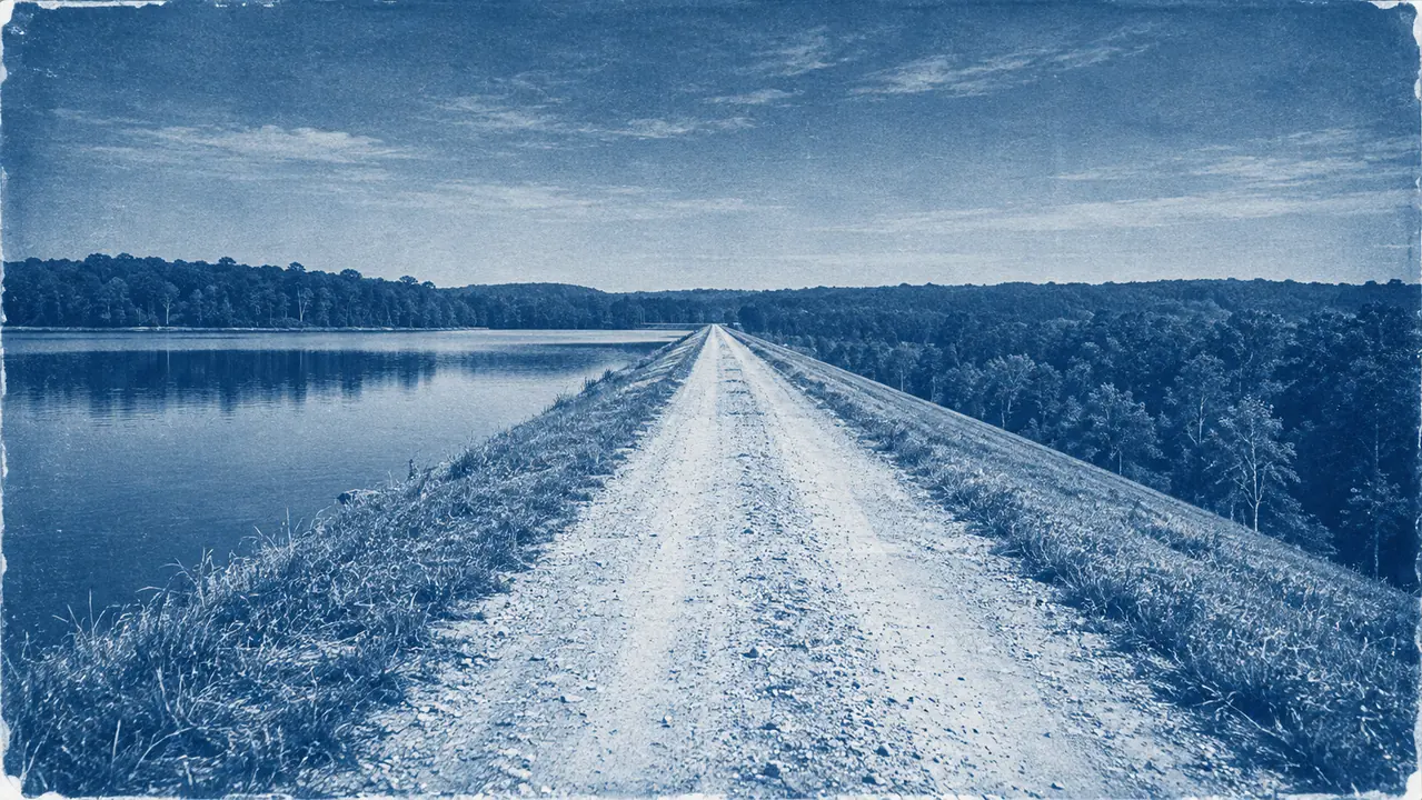 Generated cyanotype-style reconstruction of the road across the South Fork dam