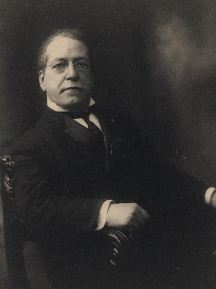 Archival photograph of Samuel Gompers, seated half-length portrait
