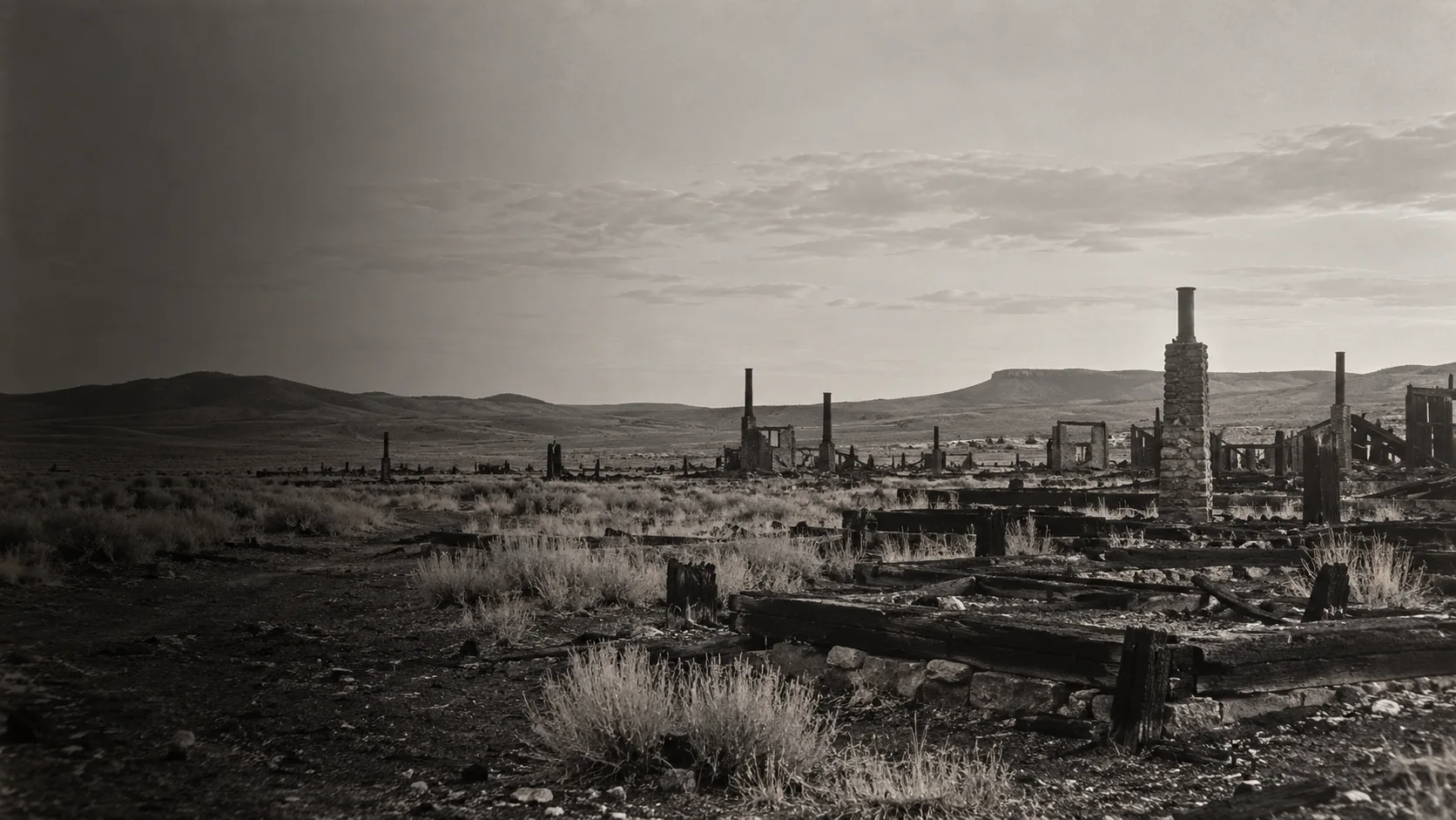 Authored illustration of a burned mining settlement in Wyoming.