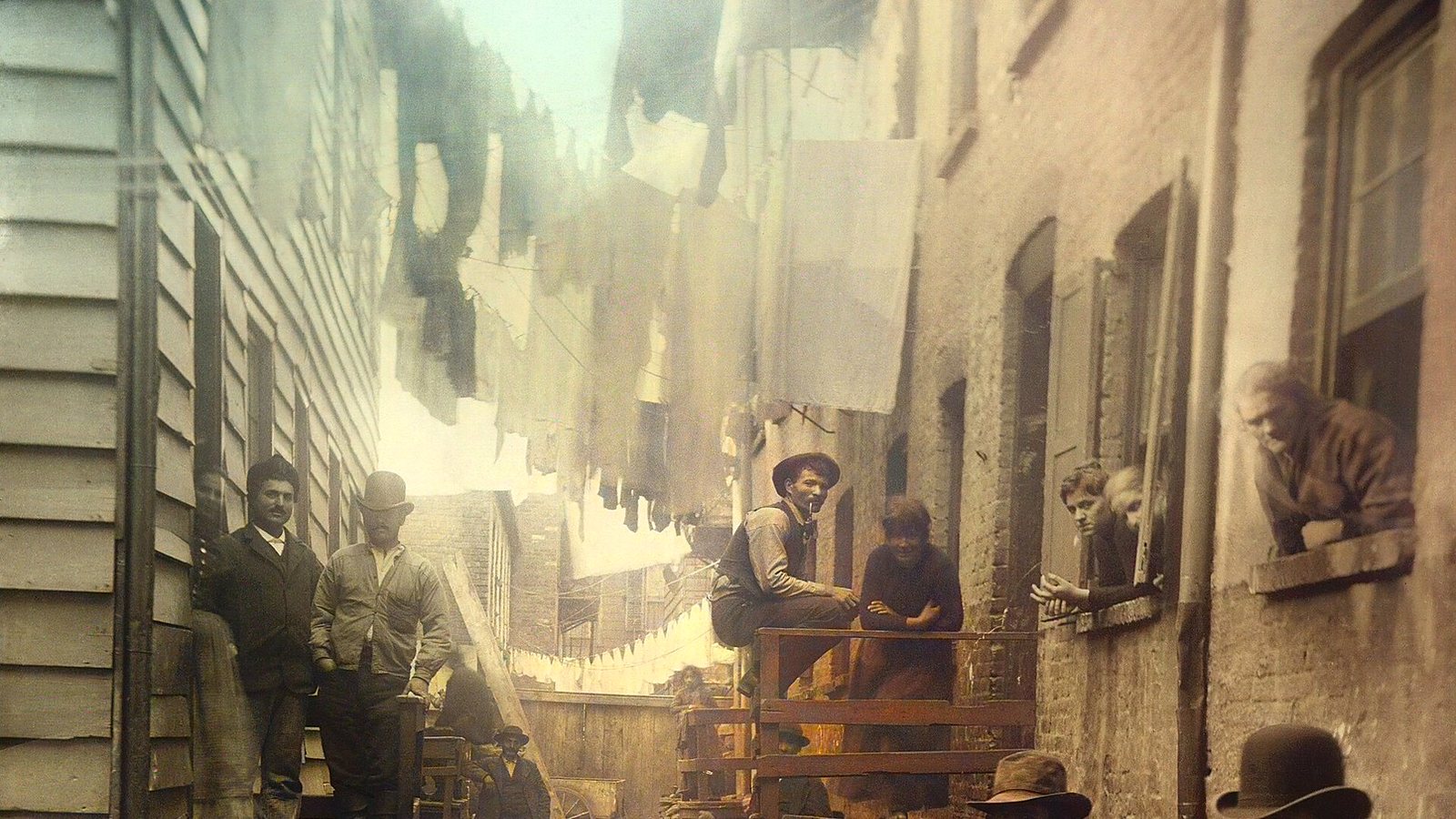 Colorized Jacob Riis photograph of Bandits Roost, an alley off Mulberry Street hung with laundry
